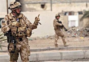 British soldiers secure the area following a road side bomb in Basra. British troops launched their pullout from Iraq with the lowering of a Royal Marines flag and handover of a Basra base to US control six years after their joint invasion.(AFP/File/Essam -al-Sudani)