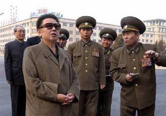 DPRK's leader Kim Jong-il (L) visits the Pyongyang Grand Theater, which was renovated, in this undated picture released by the KCNA early April 5, 2009.REUTERS/KCNA