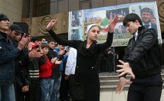 Young people dance celebrating the cancellation of the counterterrorism regime in Chechnya, in the regional capital Grozny, Chechnya, Thursday, April 16, 2009.(AP Photo/Musa Sadulayev)