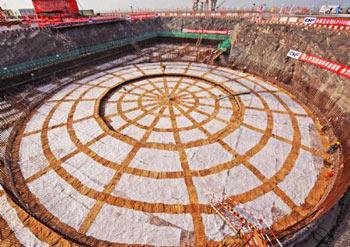 Photo taken on April 18, 2009 shows the foundational construction site of the No.1 unit of the first phase of the Sanmen nuclear plant in Zhejiang Province. The Sanmen nuclear plant, with the world's first nuclear plant using the AP1000 technologies, a type of third generation nuclear power reactor introduced by America's Westinghouse company, started the construction recently. (Xinhua/Tan Jin)