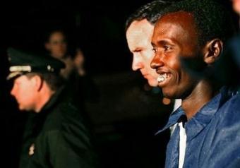 Abdi Wali Muse (R) is led into New York's Federal Plaza on April 20, 2009. Muse -- the lone surviving pirate caught by US forces in a high-seas drama off Somalia -- was ordered to stand trial here as an adult Tuesday on charges that include "piracy under the law of nations."(AFP/GettyImages/File/Stephen Chernin)