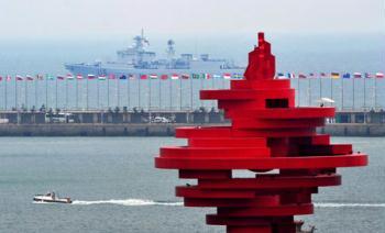 The Chinese People's Liberation Army (PLA) Navy's missile destroyer Shijiazhuang sets out for the sea to take part in the PLA naval fleet parade marking the 60th anniversary of the founding of the PLA Navy, in Qingdao, east China's Shandong Province, on April 23, 2009. (Xinhua/Li Ziheng)