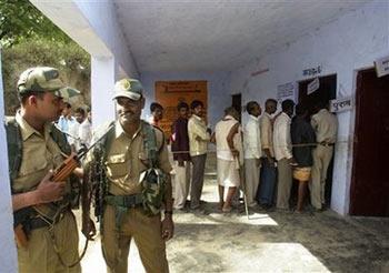 Paramilitary&nbsp;soldiers&nbsp;stand&nbsp;guard&nbsp;outside&nbsp;a&nbsp;polling&nbsp;booth&nbsp;in&nbsp;Ayodhya,&nbsp;India,&nbsp;Thursday,&nbsp;April&nbsp;23,&nbsp;2009.&nbsp;Suspected&nbsp;communist&nbsp;rebels&nbsp;used&nbsp;a&nbsp;homemade&nbsp;bomb&nbsp;to&nbsp;attack&nbsp;a&nbsp;jeep&nbsp;carrying&nbsp;election&nbsp;officials,&nbsp;injuring&nbsp;two&nbsp;people,&nbsp;as&nbsp;voting&nbsp;began&nbsp;Thursday&nbsp;in&nbsp;the&nbsp;second&nbsp;round&nbsp;of&nbsp;India's&nbsp;month&nbsp;long&nbsp;national&nbsp;elections,&nbsp;officials&nbsp;said.(AP&nbsp;Photo/Gurinder&nbsp;Osan)&nbsp;