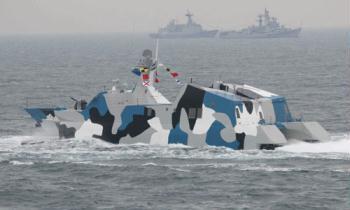 A new type of missile speed boat of the Chinese People's Liberation Army (PLA) Navy takes part in a naval parade of the PLA Navy warships and aircraft in waters off Qingdao, east China's Shandong Province, on April 23, 2009.(Xinhua/Wang Jianmin)
