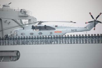 A Chinese People's Liberation Army (PLA) naval vessel is seen during a naval parade of the PLA Navy warships and aircraft in waters off Qingdao, east China's Shandong Province, on April 23, 2009. (Xinhua/Li Gang)
