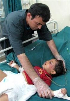 A&nbsp;child&nbsp;injured&nbsp;in&nbsp;a&nbsp;bomb&nbsp;blast&nbsp;gets&nbsp;treatment&nbsp;in&nbsp;a&nbsp;hospital&nbsp;in&nbsp;Baghdad,&nbsp;Iraq,&nbsp;Thursday,&nbsp;April&nbsp;23,&nbsp;2009.&nbsp;A&nbsp;suicide&nbsp;bomber&nbsp;blew&nbsp;himself&nbsp;up&nbsp;among&nbsp;a&nbsp;group&nbsp;of&nbsp;Iraqis&nbsp;collecting&nbsp;humanitarian&nbsp;aid&nbsp;Thursday&nbsp;in&nbsp;a&nbsp;mainly&nbsp;Shiite&nbsp;area&nbsp;in&nbsp;Baghdad,&nbsp;killing&nbsp;at&nbsp;least&nbsp;22&nbsp;people,&nbsp;the&nbsp;Iraqi&nbsp;military&nbsp;said.(AP&nbsp;Photo/Adil&nbsp;al-Khazali)