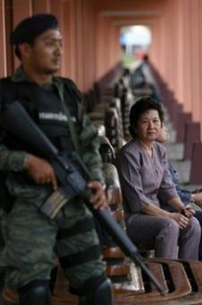 Thai&nbsp;passengers&nbsp;wait&nbsp;for&nbsp;a&nbsp;train&nbsp;watched&nbsp;by&nbsp;a&nbsp;soldier&nbsp;at&nbsp;a&nbsp;railway&nbsp;station&nbsp;in&nbsp;Thailand's&nbsp;restive&nbsp;southern&nbsp;Yala&nbsp;province.&nbsp;Suspected&nbsp;militants&nbsp;in&nbsp;Thailand's&nbsp;deep&nbsp;south&nbsp;killed&nbsp;nine&nbsp;people&nbsp;and&nbsp;injured&nbsp;two&nbsp;others&nbsp;in&nbsp;five&nbsp;separate&nbsp;attacks&nbsp;on&nbsp;the&nbsp;eve&nbsp;of&nbsp;a&nbsp;key&nbsp;anniversary&nbsp;for&nbsp;the&nbsp;restive&nbsp;region,&nbsp;police&nbsp;said.(AFP/File/Muhammad&nbsp;Sabri)