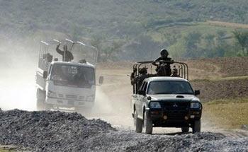 Pakistani army troops on patrol in the Umar Abad area outside the troubled Buner district. Pakistan said Wednesday its troops have seized control of the main town in the northwest region of Buner after launching a new air and ground offensive against Taliban militants.(AFP/Tariq Mahmood) 