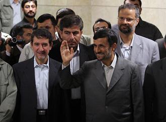 Iranian President Mahmoud Ahmadinejad waves to reporters as he comes to register his candidacy for the upcoming presidential elections at the interior ministry in Tehran on May 8, 2009. Ahmadinejad was the second of the four leading candidates expected to stand in the June 12 election to formally register. (Xinhua/Ahmad Halabisaz)