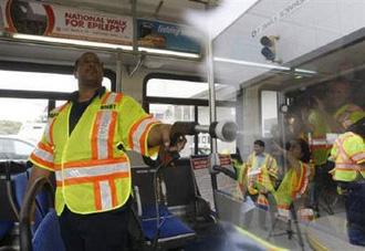Metrobus&nbsp;worker&nbsp;Gerald&nbsp;Irons&nbsp;demonstrates&nbsp;the&nbsp;cleaning&nbsp;and&nbsp;disinfecting&nbsp;process&nbsp;used&nbsp;to&nbsp;protect&nbsp;riders&nbsp;and&nbsp;employees&nbsp;from&nbsp;contracting&nbsp;the&nbsp;influenza&nbsp;A&nbsp;(H1N1)&nbsp;virus,&nbsp;at&nbsp;the&nbsp;Washington-area&nbsp;Landover&nbsp;Metrobus&nbsp;division&nbsp;in&nbsp;Hyattsville,&nbsp;Maryland,&nbsp;April&nbsp;30,&nbsp;2009.&nbsp;REUTERS/Jason&nbsp;Reed/Files