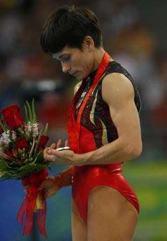 Silver&nbsp;medallist&nbsp;Oksana&nbsp;Chusovitina&nbsp;of&nbsp;Germany&nbsp;looks&nbsp;at&nbsp;her&nbsp;medal&nbsp;during&nbsp;the&nbsp;medal&nbsp;presentation&nbsp;ceremony&nbsp;for&nbsp;the&nbsp;gymnastics&nbsp;women's&nbsp;vault&nbsp;final&nbsp;at&nbsp;the&nbsp;Beijing&nbsp;2008&nbsp;Olympic&nbsp;Games.