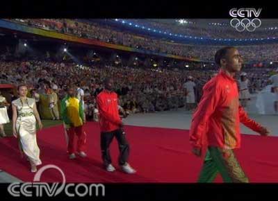The&nbsp;music&nbsp;for&nbsp;marathon&nbsp;victory&nbsp;is&nbsp;played.&nbsp;The&nbsp;winning&nbsp;athletes&nbsp;and&nbsp;award&nbsp;presenters&nbsp;enter.