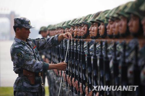 Side view of a lineup of officers and soldiers