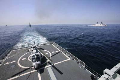 China's navy "Guangzhou" destroyer is seen at the Arabia Sea off the southern Pakistani port of Karachi, on Mar. 9, 2009. Warships from participating countries Monday began their second phase of the two-week-long AMAN 09 military exercises at the Arabia Sea off the southern Pakistani port of Karachi. (Xinhua photo)