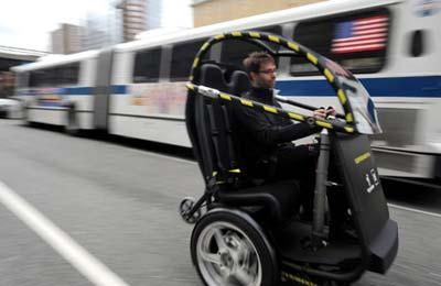 The Project P.U.M.A., an electric two-seat prototype vehicle conducts street show in New York's Times Square on Sunday, April 7, 2009. The Project P.U.M.A. vehicle (Personal Urban Mobility and Accessibility) combines technologies from Segway and General Motors to increase mobility freedom with zero emissions, enhanced safety, seamless connectivity and reduced congestion in cities.(Xinhua/AFP Photo)