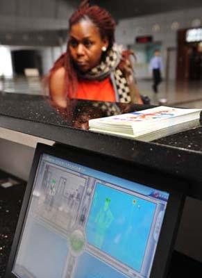 A foreign traveler receives temperature check at Guangzhou East Railway Station in Guangzhou, capital of south China's Guangdong Province, April 29, 2009. An average of nearly 5,000 people arrive at the railway station every day during the the Canton Fair, known as China's largest export event. China has enhanced swine flu prevention and control measures nationwide to prevent possible spread of the disease. (Xinhua photo) 